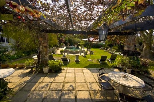 The beautiful pool and lush garden at Forest Hall Guest House.