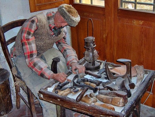 Image depicting a cobbler at work. By Georges Jansoone (Creative Commons)