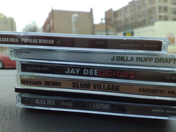 CDs in car by grgbrwn (Flickr)