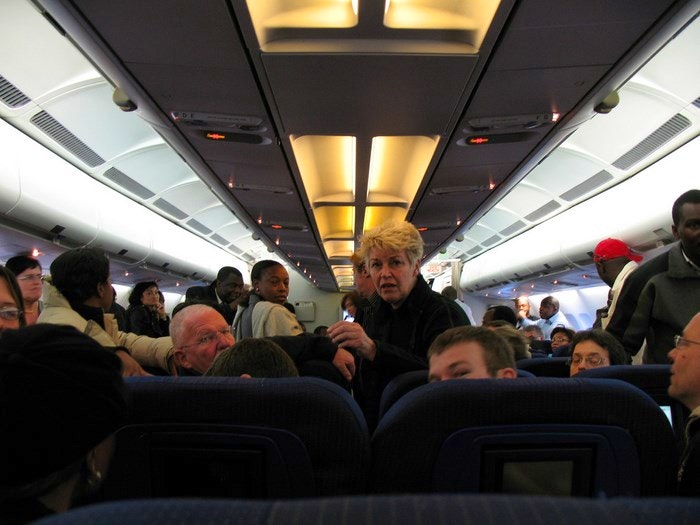 Aeroplane passenger by emeryjl (Flickr)