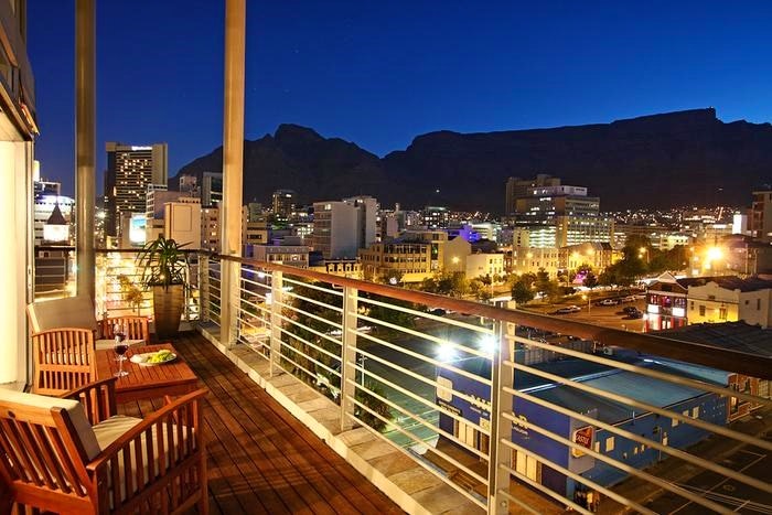 Table Mountain and city lights by A5 Soho On Strand (TG)