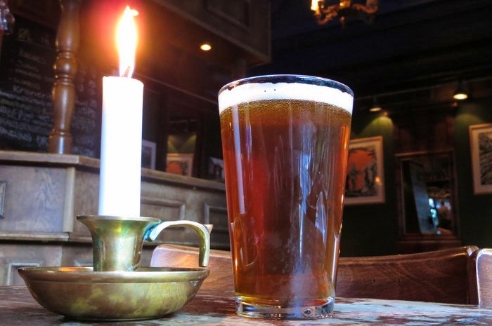 Beer and a candle. By Brostad (Flickr)