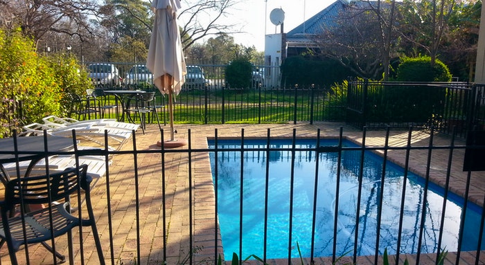 Pool Area at Rivierbos Guest House by Lauren Morling