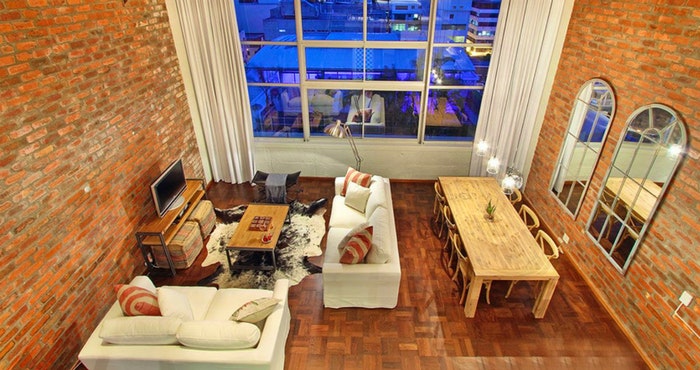 Mountain View Loft features large windows and spectacular city views | Photo: TravelGround
