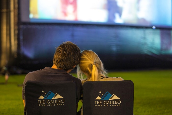 A couple enjoying a movie at the Galileo Open Air Cinema